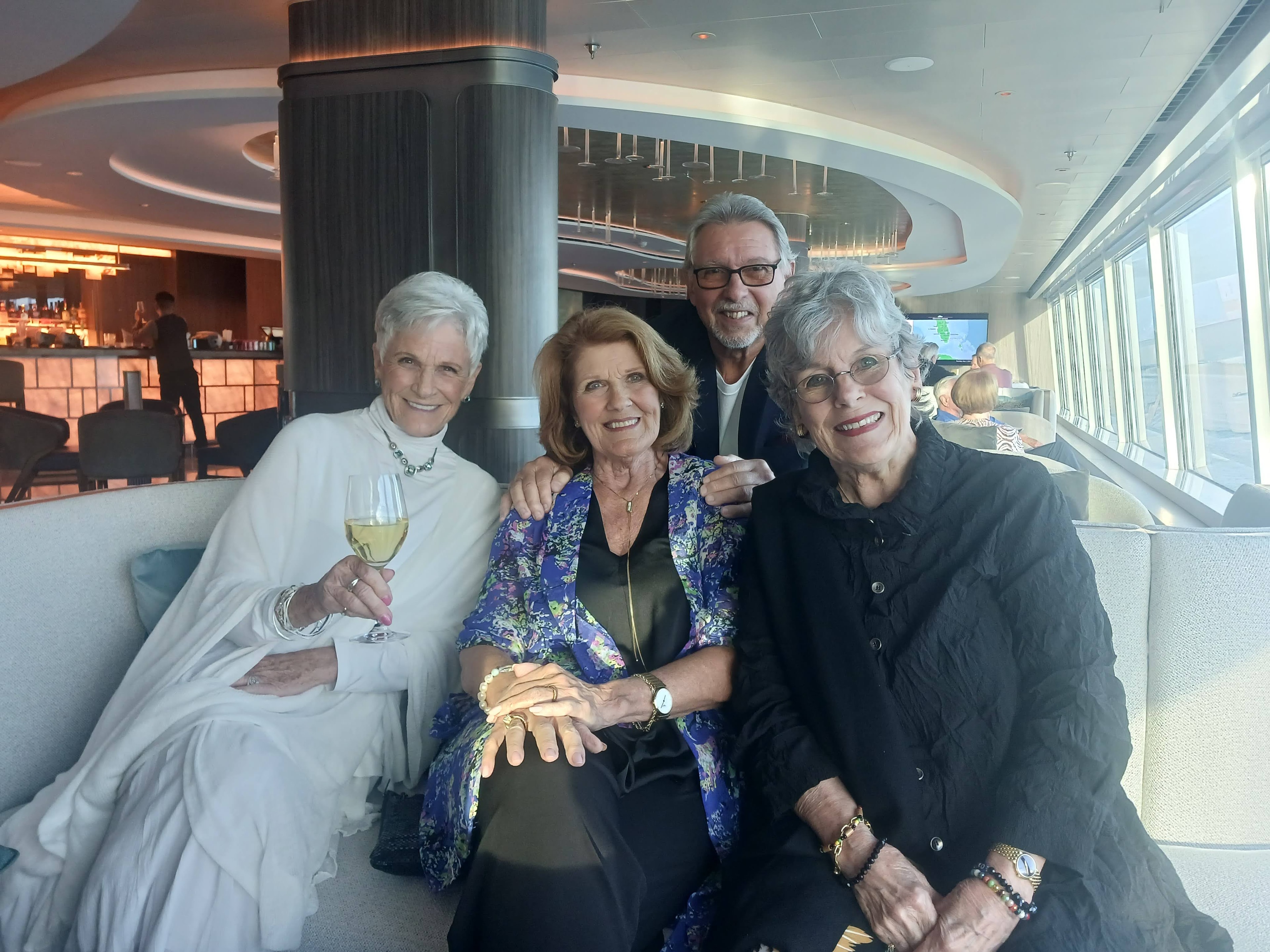 Three women together at an art event